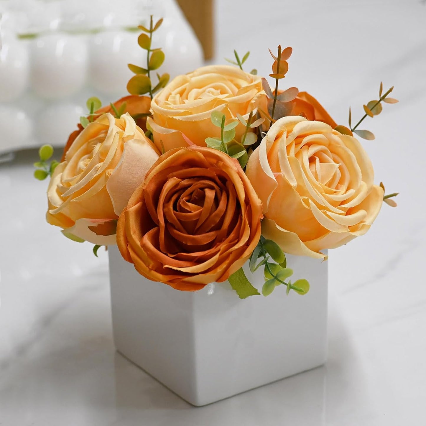 LADADA Artificial Roses in White Ceramic Vase, Orange and Cream Fake Flowers with Eucalyptus Stems, Faux Floral Arrangement for Home Decor, Table Centerpiece for Dining Table, Kitchen, Office